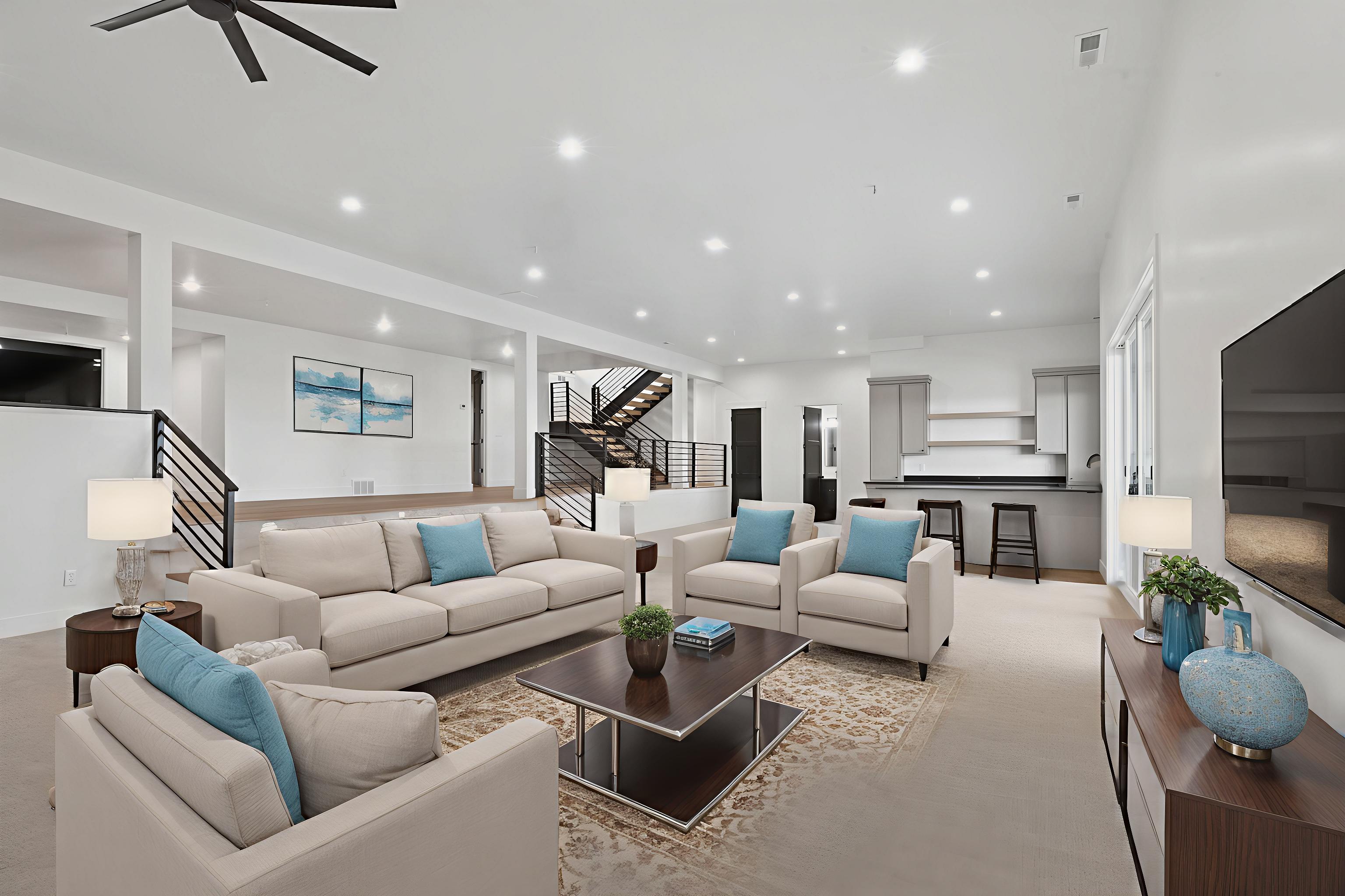 Carpeted living area with recessed lighting and ceiling fan