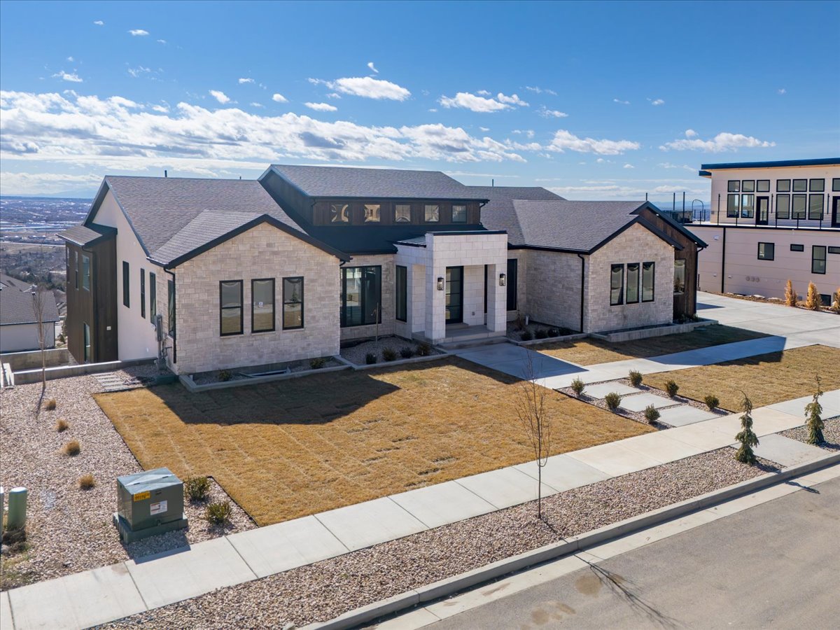 View of front of home featuring brick siding