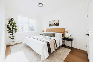 Bedroom with light wood-style floors