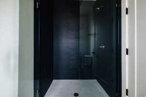 Full bath with a shower stall