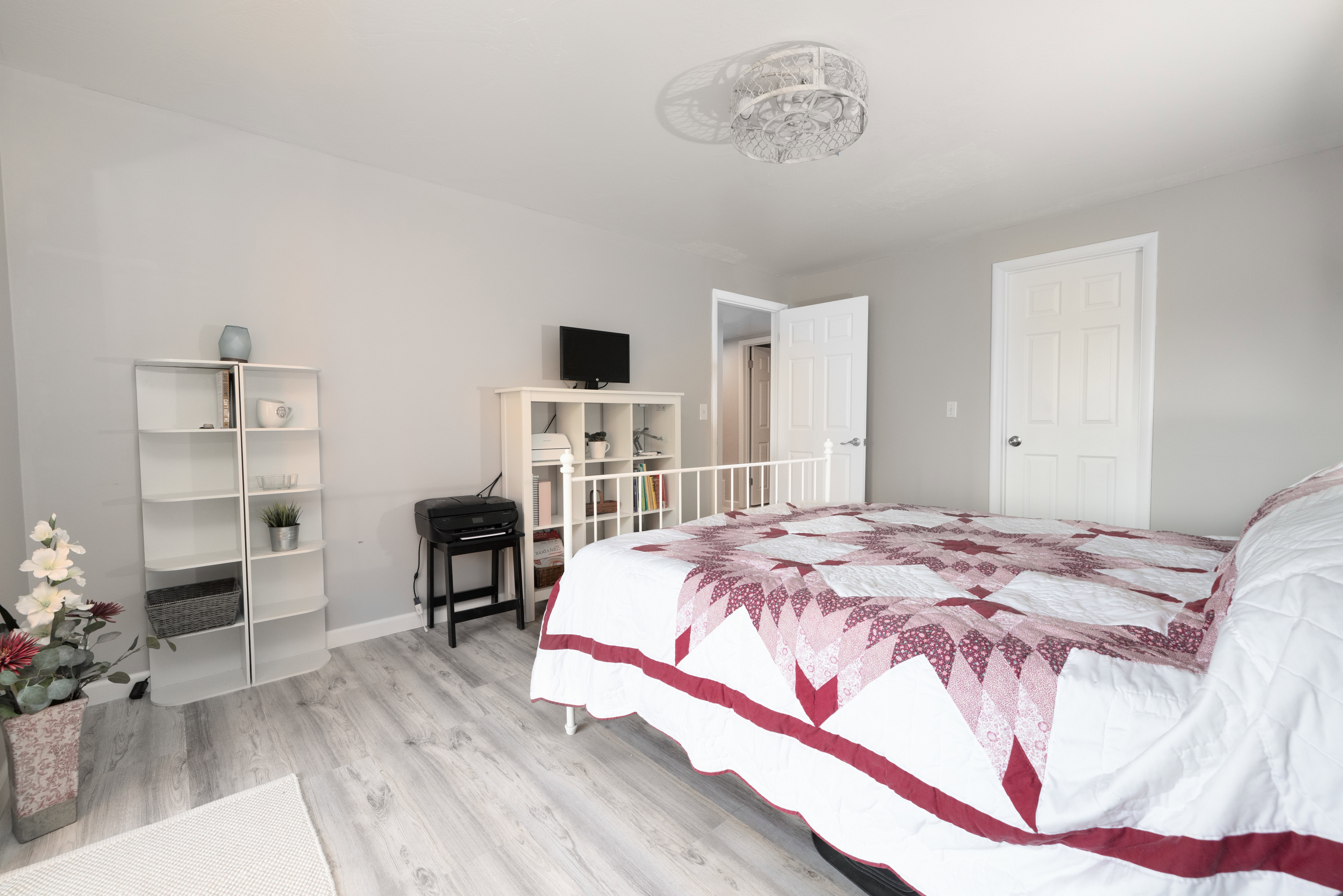 Bedroom featuring light wood-style floors and baseboards