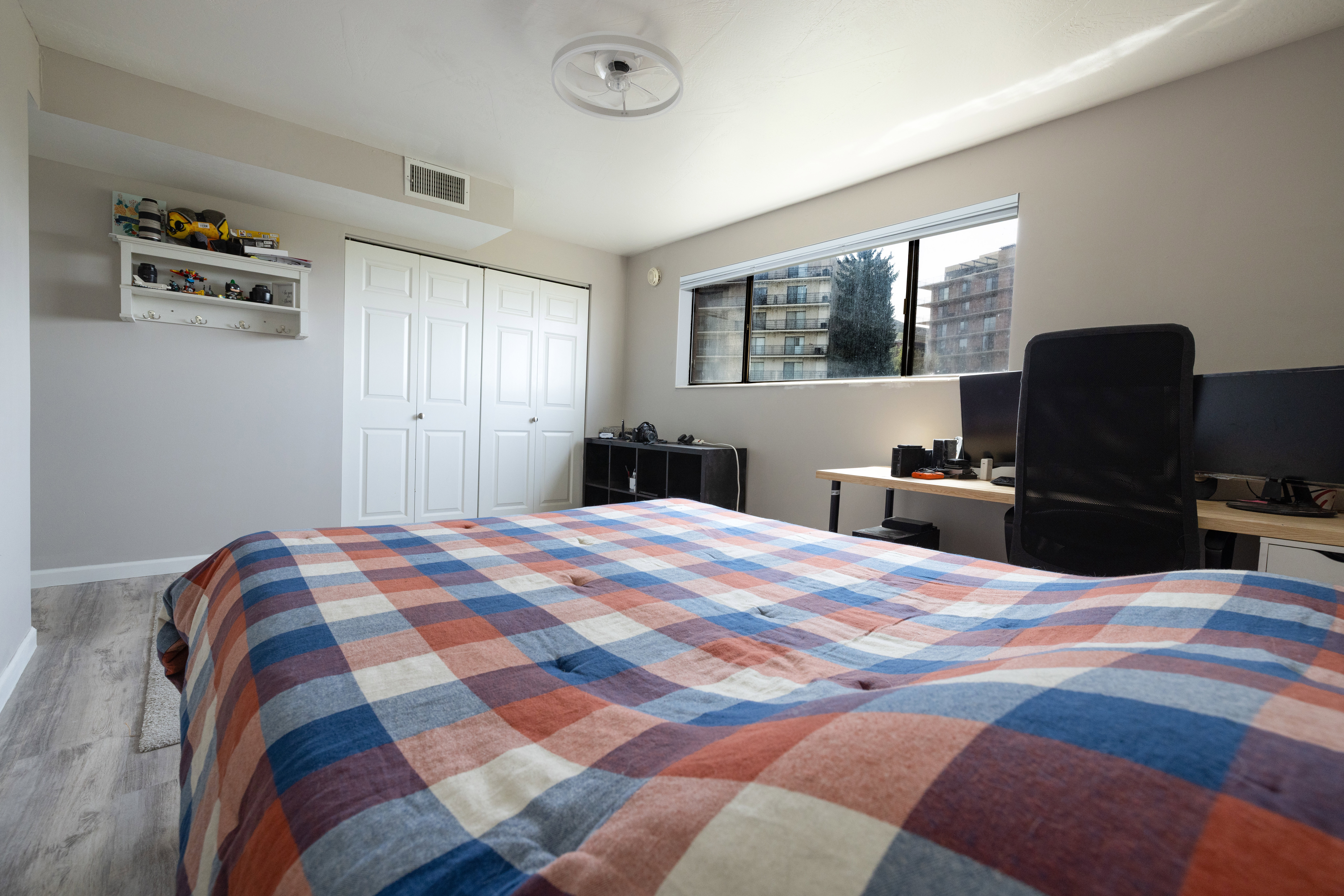 Bedroom featuring wood finished floors and a closet