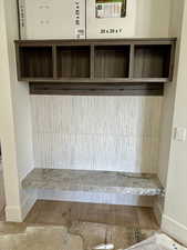 sitting / storage area by garage door