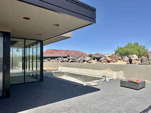 View of patio / terrace with a mountain view