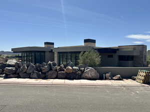 View of front facade featuring a chimney