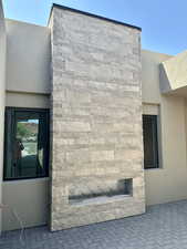 Fireplace in entry courtyard