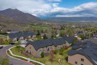 Aerial view of residential area featuring a mountainous background