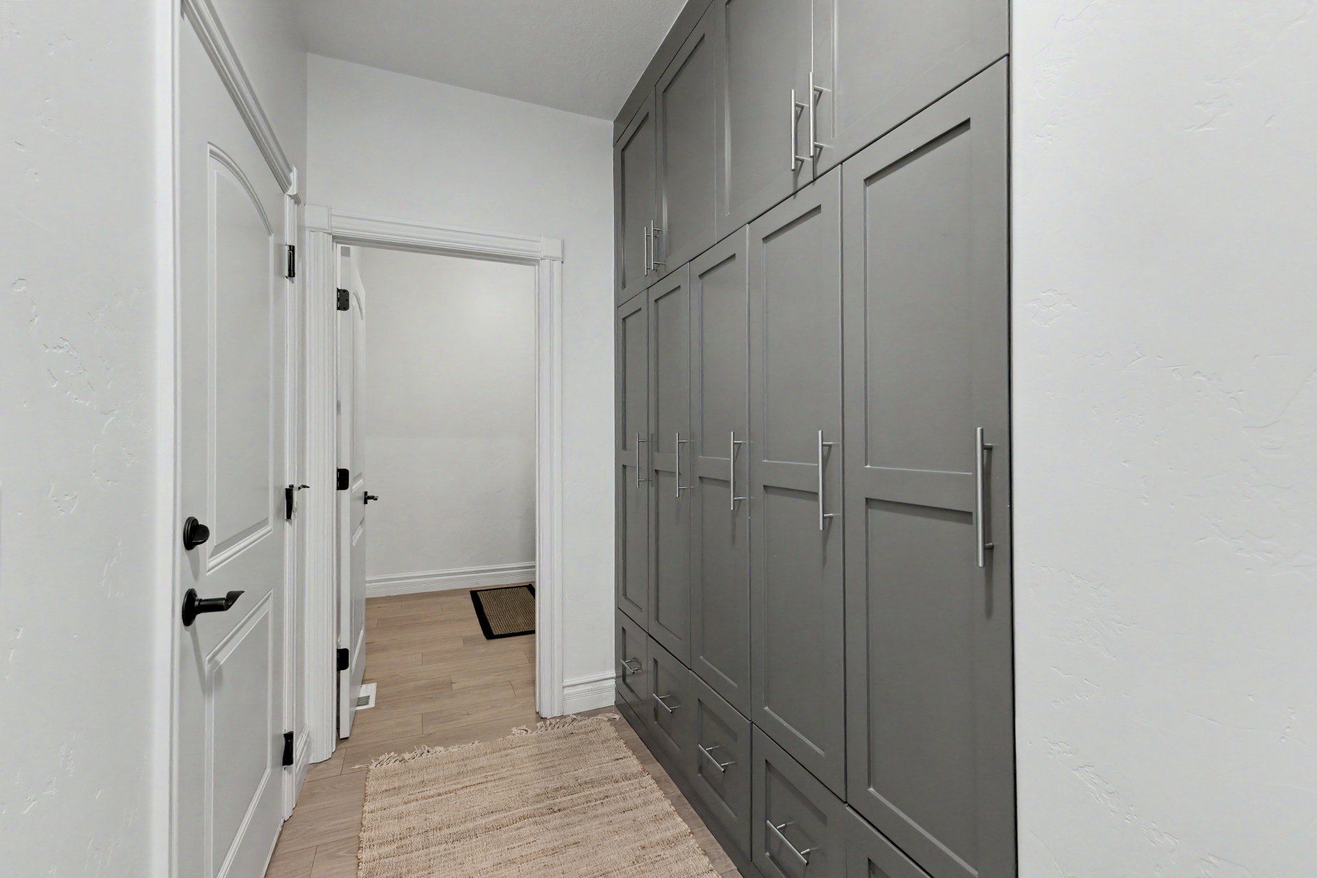 Hall with light wood finished floors