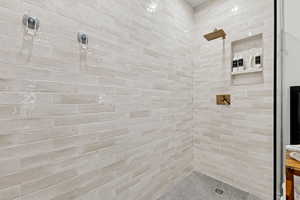 Full bath with tiled shower