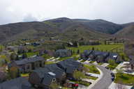 Aerial view of residential area featuring a mountainous background
