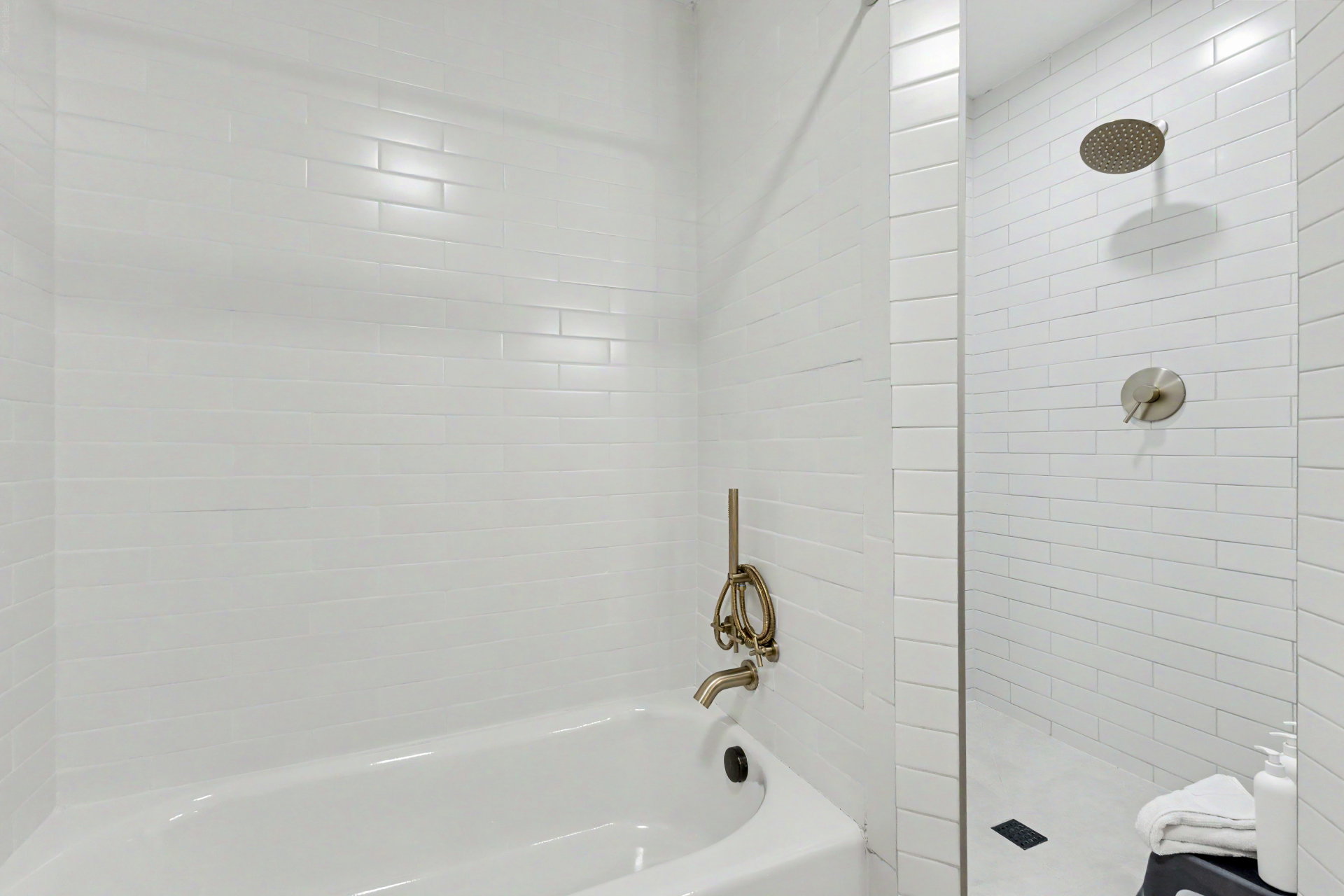 Bathroom with tiled shower and a garden tub