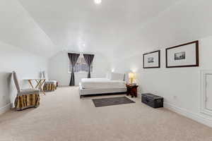 Bedroom with light carpet and recessed lighting