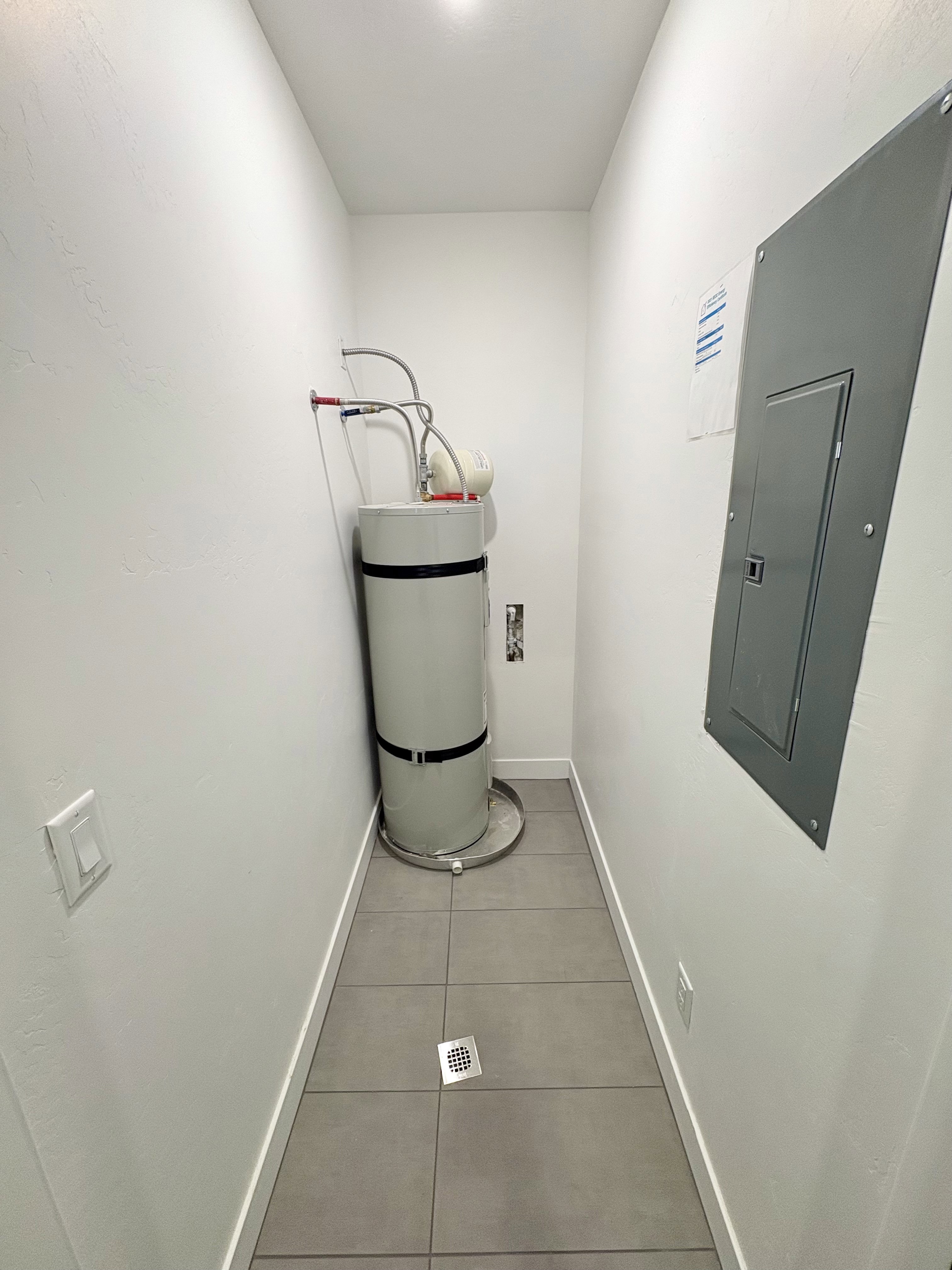 Utility room featuring electric panel
