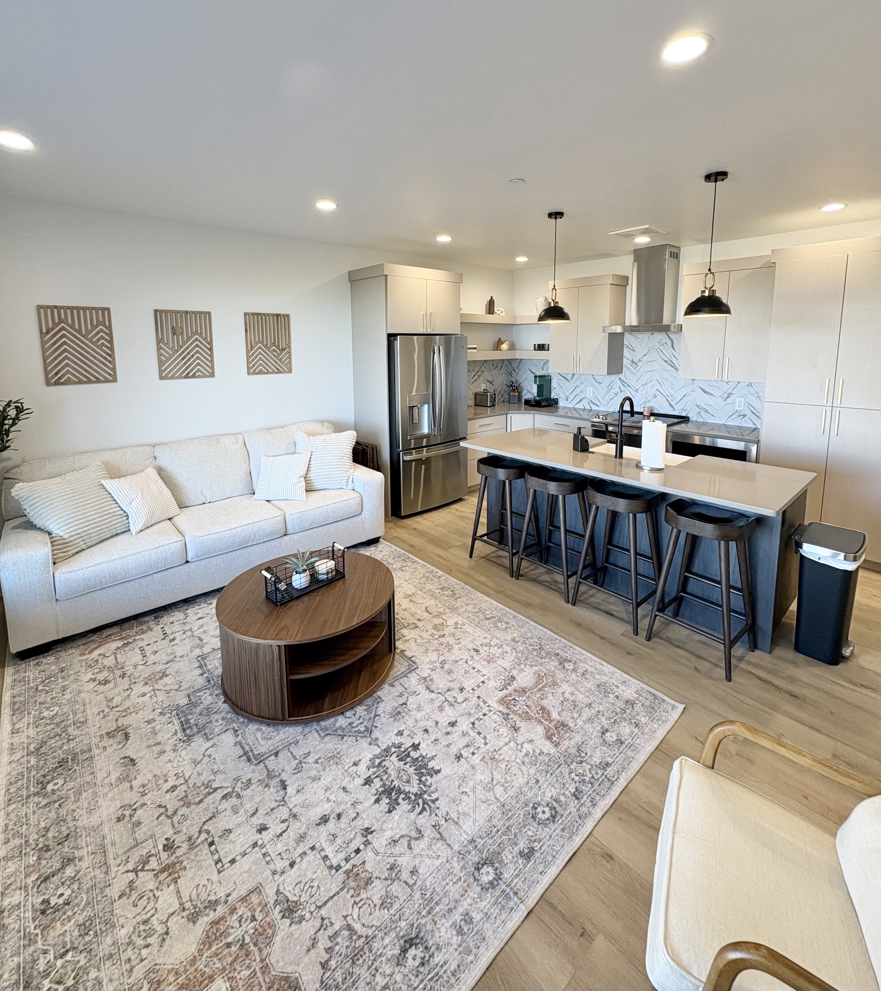 Living room featuring light wood-style floors and recessed lighting