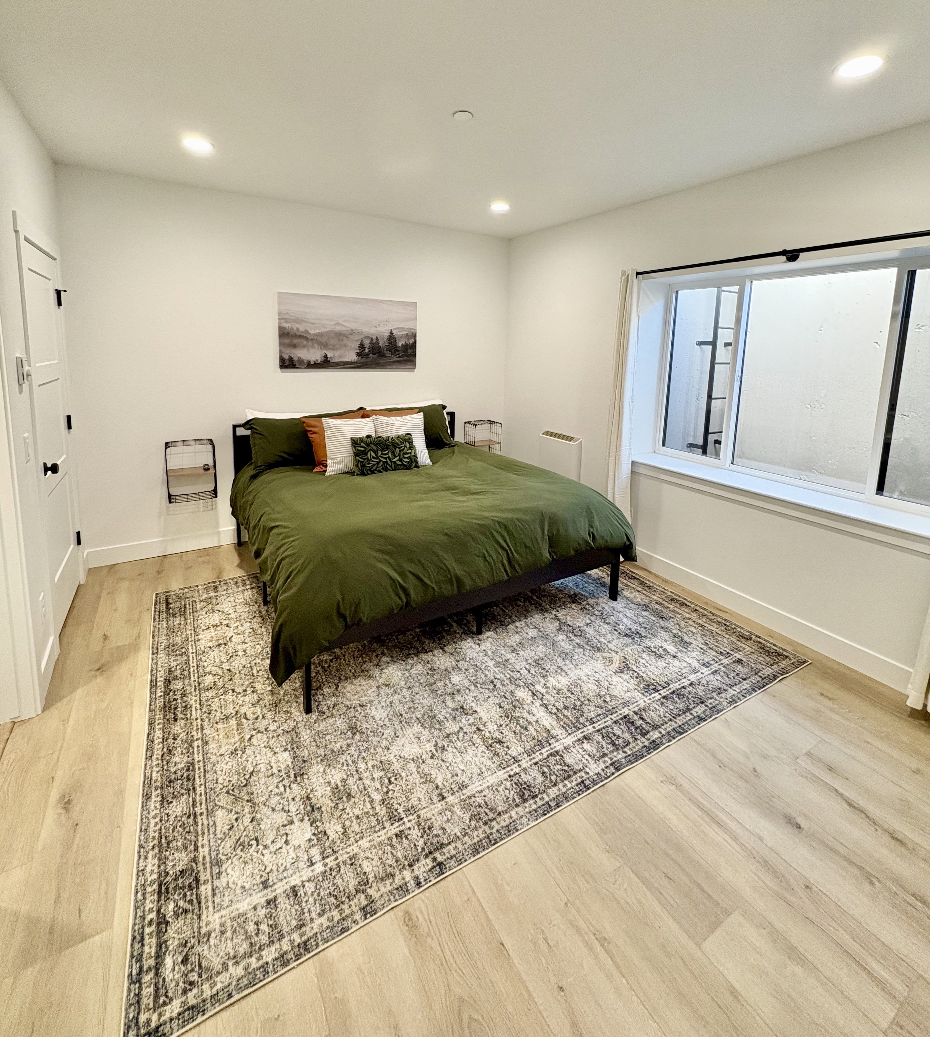 Bedroom with light wood-style flooring and recessed lighting