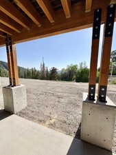 View of yard with elevator and a patio