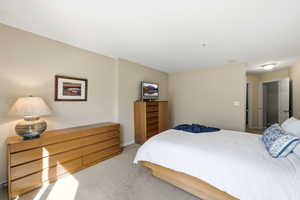 Carpeted bedroom with baseboards