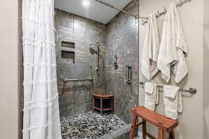 Full bathroom with a shower stall
