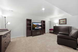 Living room with light carpet and baseboards