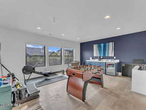 Playroom featuring wine cooler and recessed lighting