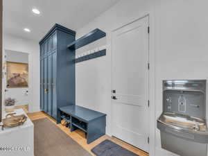 Mudroom with light wood-style floors and recessed lighting