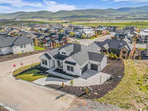 Aerial perspective of suburban area with a mountain backdrop