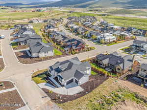 Aerial perspective of suburban area featuring a mountainous background