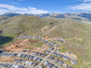 Aerial view of residential area featuring a mountainous background
