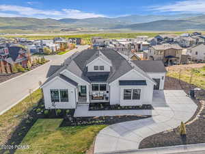 Aerial view of residential area featuring a mountain backdrop