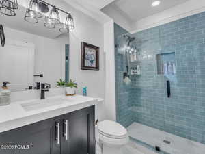 Full bath with vanity and a stall shower