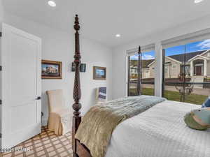 Bedroom featuring light floors and recessed lighting
