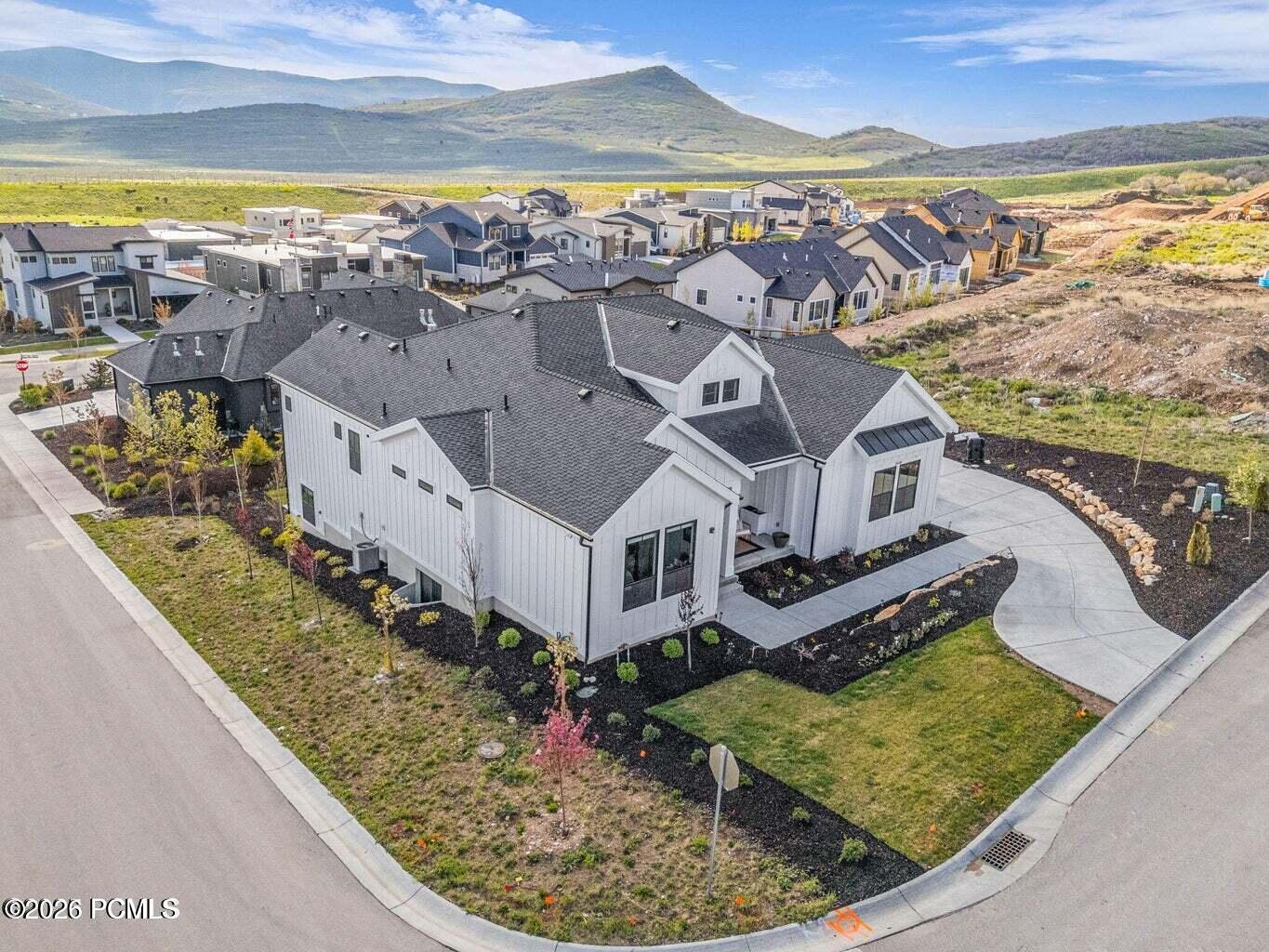 Aerial view of residential area featuring mountains