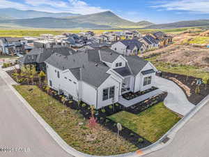 Aerial view of residential area featuring mountains