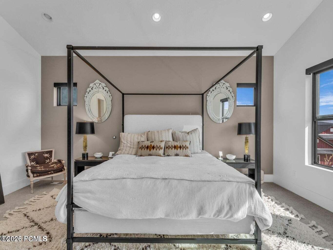 Bedroom with carpet floors, recessed lighting, and vaulted ceiling