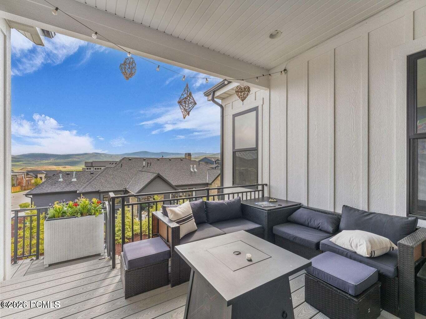 Wooden deck featuring an outdoor living space