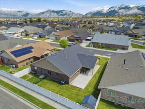 Aerial view of residential area featuring mountains