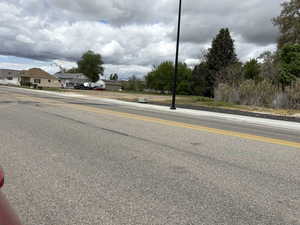 View of asphalt street with sidewalks