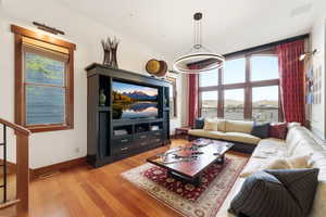 Living area featuring light wood-style floors and baseboards