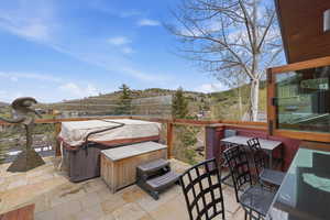 View of patio featuring a hot tub