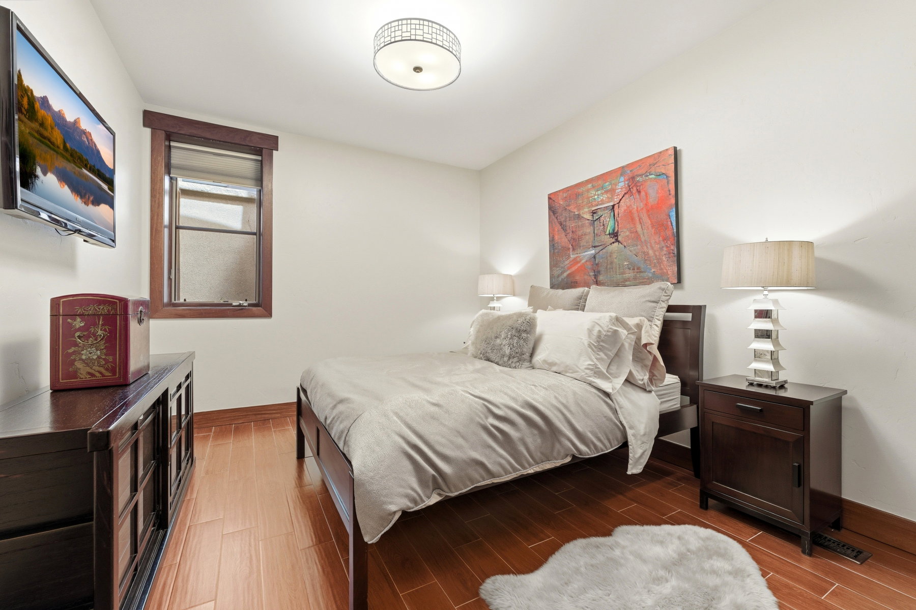 Bedroom with baseboards and wood tiled floors