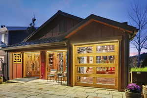 Rear view of property featuring a standing seam roof and a patio area
