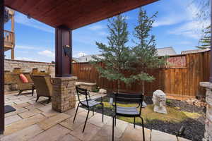 Fenced backyard with a patio area