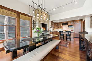 Dining room featuring dark wood finished floors and rail lighting