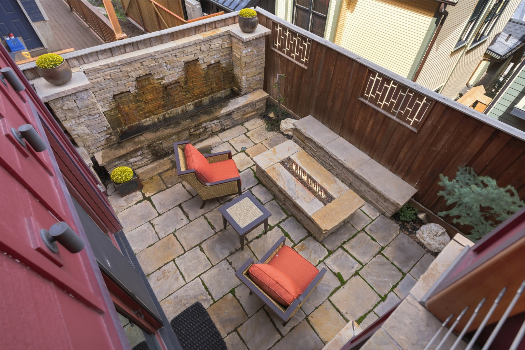 View of patio featuring grilling area and an outdoor stone fireplace