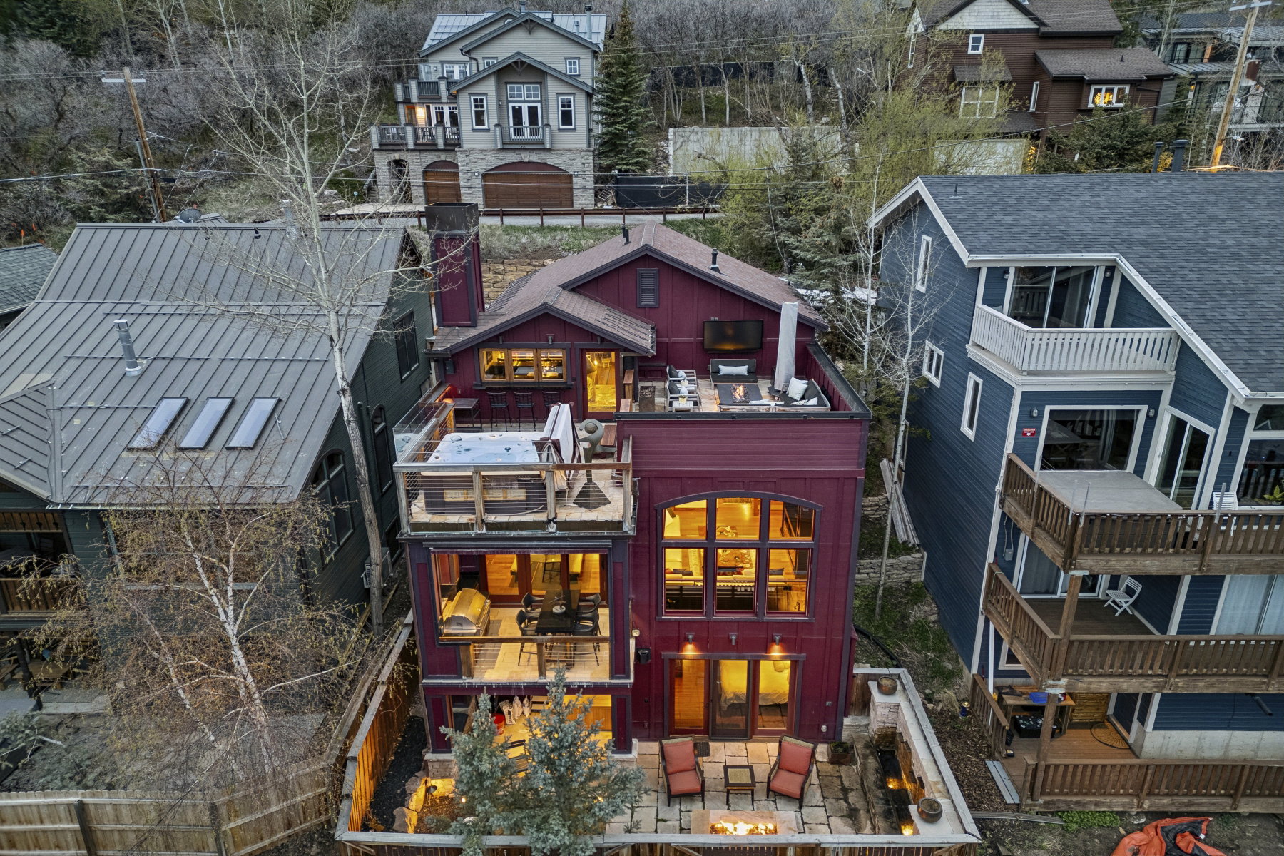 Back of house featuring a balcony, a fenced backyard, a patio, and outdoor furniture