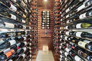 Wine cellar featuring wood ceiling