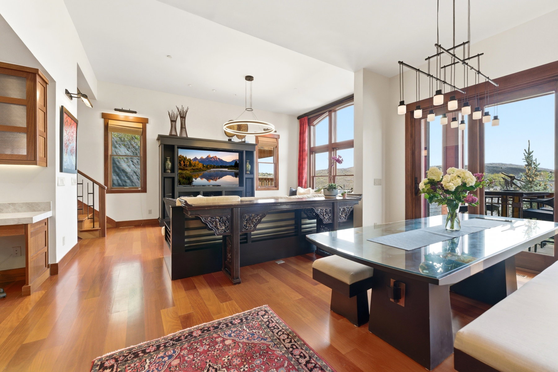 Dining area featuring light wood finished floors and healthy amount of natural light