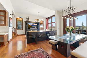 Dining area featuring light wood finished floors and healthy amount of natural light