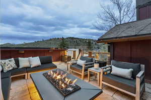 View of patio / terrace featuring an outdoor living space with a fire pit