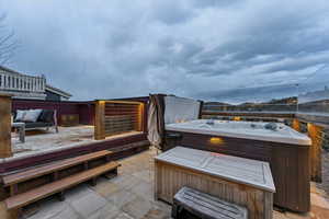 View of patio / terrace with a hot tub and outdoor lounge area
